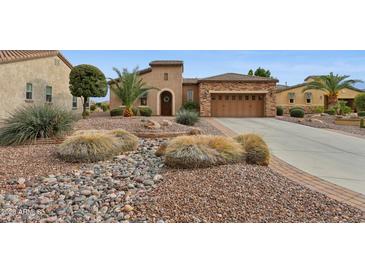 Beautiful desert landscape surrounds this single-story home with a large garage at 28365 N 124Th Dr, Peoria, AZ 85383