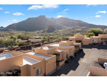 Beautiful building with mountain views and desert landscaping in a sunny neighborhood at 37222 N Tom Darlington Dr # 11, Carefree, AZ 85377