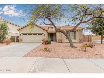 Single-story home with a two-car garage and desert landscaping at 4170 E Winged Foot Pl, Chandler, AZ 85249