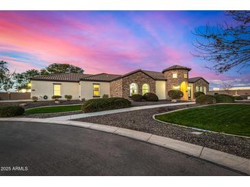 Stunning curb appeal with stone accents and a landscaped yard at 4368 E Estrella Ct, Gilbert, AZ 85296