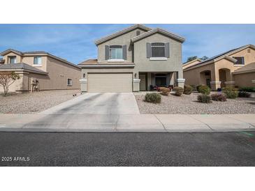 Two-story home with desert landscaping and covered porch at 12378 W Roma Ave, Avondale, AZ 85392