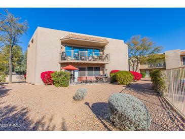 Building exterior with balcony and landscaping at 16616 E Palisades Blvd # 201, Fountain Hills, AZ 85268