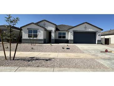 One-story house with a two-car garage and desert landscaping at 25570 N 154Th Ln, Surprise, AZ 85387