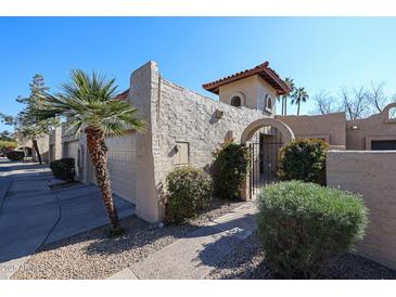 Spanish style home with gated entry and attached garage at 3013 W Phelps Rd, Phoenix, AZ 85053