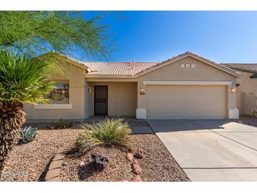 Single-story house with a two-car garage and desert landscaping at 30573 N Royal Oak Way, San Tan Valley, AZ 85143