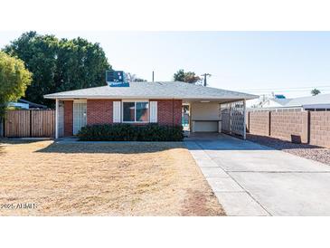 Brick ranch home with carport and spacious yard at 621 W Howe St, Tempe, AZ 85281