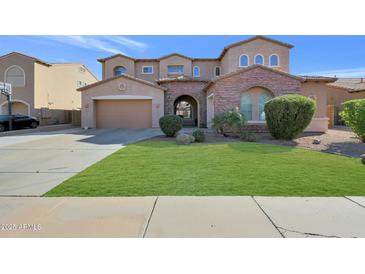 Two-story home with stone accents and landscaped front yard at 3007 S Colonial St, Gilbert, AZ 85295