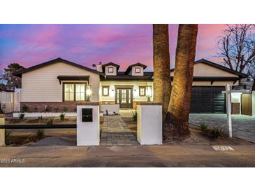 Charming home with a brick-lined walkway, dormer windows, and a cozy, inviting front entrance at 3021 N 47Th St, Phoenix, AZ 85018