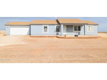 Single-story home featuring a front yard and a one car garage at 37116 W Amberwood --, Tonopah, AZ 85354