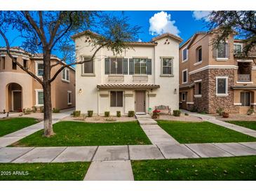 Two-story home with a landscaped lawn and walkway at 428 N Mahogany Ct, Gilbert, AZ 85233