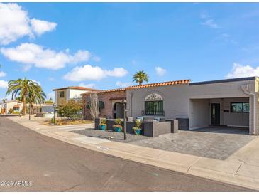 Beautiful mid-century modern home with updated landscaping and driveway at 4809 N 78Th Pl, Scottsdale, AZ 85251