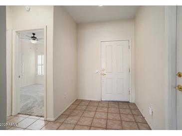 Bright entryway with tile flooring and view of adjacent room at 16148 W Starlight Dr, Surprise, AZ 85374