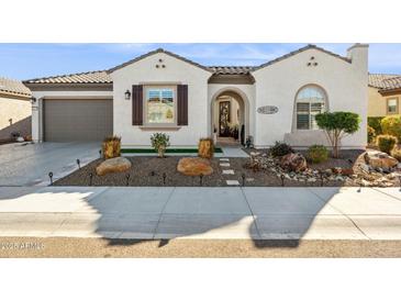 Single-story home with a two-car garage and landscaped front yard at 26019 W Ponderosa Ln, Buckeye, AZ 85396