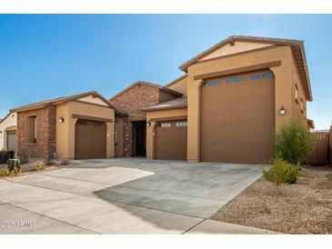 Two story home with three car garage and desert landscaping at 3923 W Hayduk Rd, Laveen, AZ 85339