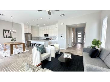 Open concept kitchen and living area with modern appliances and ample natural light at 6301 N 12Th St # 8, Phoenix, AZ 85014