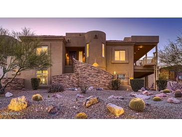 Stunning desert contemporary home with a large covered patio and beautiful landscaping at 4590 S Gold Canyon Dr, Gold Canyon, AZ 85118