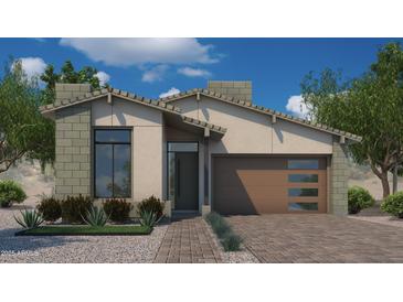 Single-story home with brown garage door and desert landscaping at 6727 N 9Th Dr, Phoenix, AZ 85013
