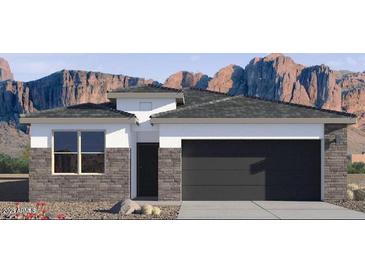 Single-story home with a two-car garage and mountain views at 15397 W Hackamore Dr, Surprise, AZ 85387