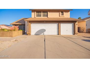 Two-story house with a two-car garage and a basketball hoop at 17463 N 63Rd Dr, Glendale, AZ 85308