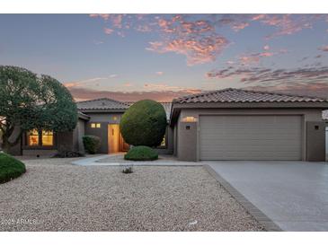 One-story home with a two-car garage and desert landscaping at 17802 N Bridle Ln, Surprise, AZ 85374