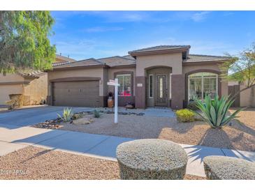 Single-story home with desert landscaping and a two-car garage at 2227 W Calle Del Sol --, Phoenix, AZ 85085