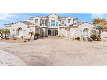 Stunning two-story home with a three-car garage and landscaped front yard at 2822 E Clifton Ct, Gilbert, AZ 85295