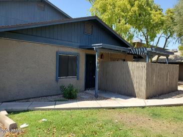 Exterior view of a charming condo with a private walkway and covered patio at 286 W Palomino Dr # 105, Chandler, AZ 85225