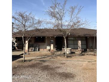 Ranch style home with a large yard and mature trees at 3106 W Elm St, Phoenix, AZ 85017