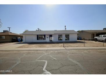 Newly remodeled home with a spacious front yard at 4901 W Cheery Lynn Rd, Phoenix, AZ 85031