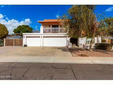 Charming two-story home with three-car garage and balcony in a well-maintained neighborhood at 6422 W Garden Dr, Glendale, AZ 85304