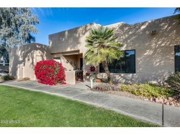 Inviting exterior with lush landscaping and a spacious patio at 14300 W Bell Rd # 502, Surprise, AZ 85374