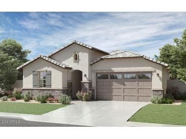 One-story home with stone accents and a two-car garage at 1431 W J Waltz Way, Apache Junction, AZ 85120