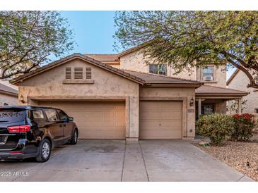 Charming two-story home with a three-car garage and well-maintained landscaping at 19308 W Jefferson St, Buckeye, AZ 85326