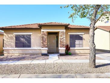 One-story house with stone accents and a landscaped front yard at 234 N Seymour --, Mesa, AZ 85207