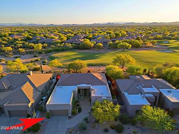 Luxury home with stunning golf course views and mountain backdrop in a desirable community at 33448 N 69Th Pl, Scottsdale, AZ 85266