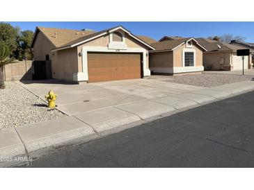 Charming single-story home featuring a two-car garage and a well-maintained concrete driveway at 4130 W Chama Dr, Glendale, AZ 85310