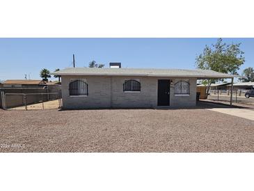 Newly renovated single story home with a carport and fenced yard at 5222 S 13Th Way, Phoenix, AZ 85040