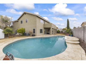 Inviting kidney-shaped pool with a large patio area at 629 E Palo Verde St, Casa Grande, AZ 85122