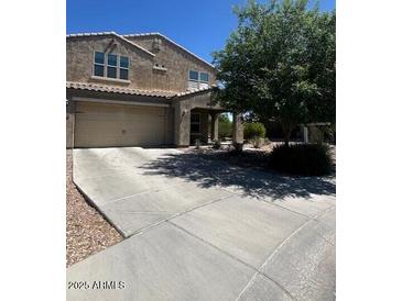 Charming two-story home with a two car garage, inviting curb appeal and lush landscaping at 2776 E Mews Rd, Gilbert, AZ 85298