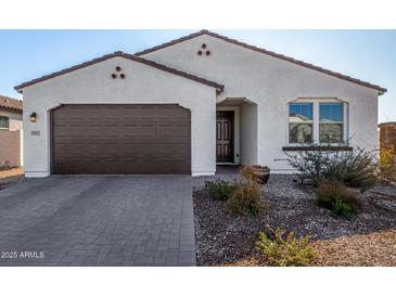 One-story home with brown garage door and landscaped yard at 3341 E Rebel Ln, San Tan Valley, AZ 85143