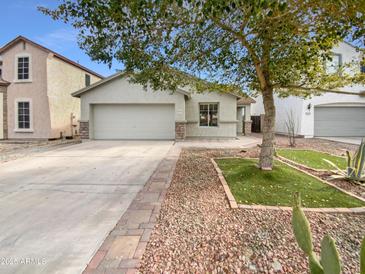 Single-story house with a two-car garage and landscaped front yard at 40551 N Jodi Dr, San Tan Valley, AZ 85140