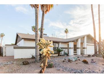 Ranch style home with desert landscaping and two-car garage at 543 W Pampa Ave, Mesa, AZ 85210