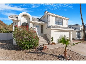 Charming two-story home with a well-manicured yard and a two-car garage at 1179 N Granada Dr, Chandler, AZ 85226