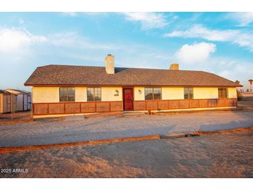 Ranch style home with brick accents and a spacious yard at 22352 W Meade Ln, Buckeye, AZ 85326