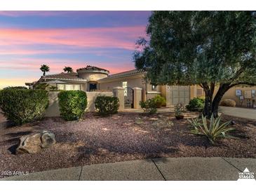 Beautiful desert landscape home with a landscaped front yard at 23313 N De La Guerra Ct, Sun City West, AZ 85375