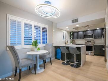 Modern kitchen with stainless steel appliances and white quartz countertops at 4303 E Cactus Rd # 128, Phoenix, AZ 85032