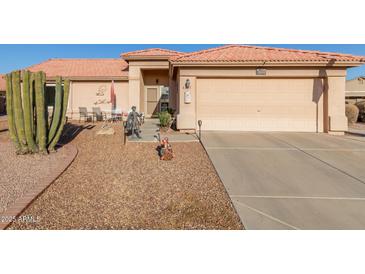 Single-story home with desert landscaping, two-car garage, and a welcoming front porch at 6331 S Cypress Point Dr, Chandler, AZ 85249