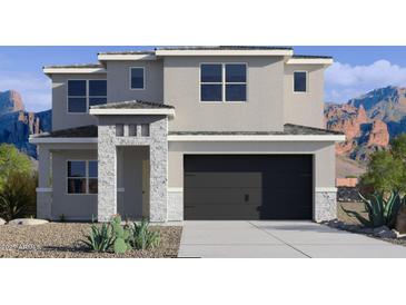 Two-story house with gray siding, stone accents, and a two-car garage at 7439 W Whitehorn Trl, Peoria, AZ 85383