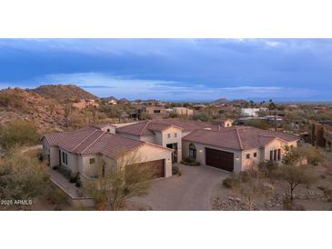 Luxury home with tile roof, large garage, and scenic mountain views at 8519 E Regina Cir, Mesa, AZ 85207