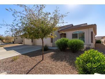 House exterior with two-car garage and desert landscaping at 10960 E Monte Ave # 223, Mesa, AZ 85209